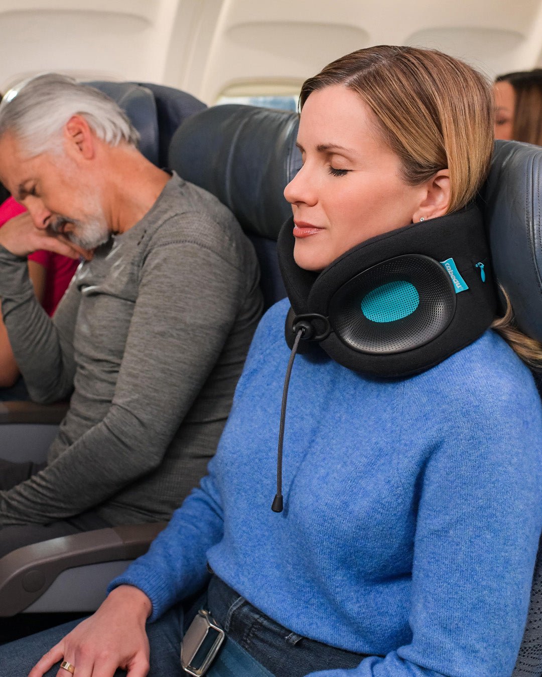 Woman wearing Evolution X Turquoise on flight